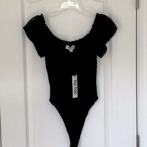 Womens Tic Toc  black short sleeve blouse body suit, size S.